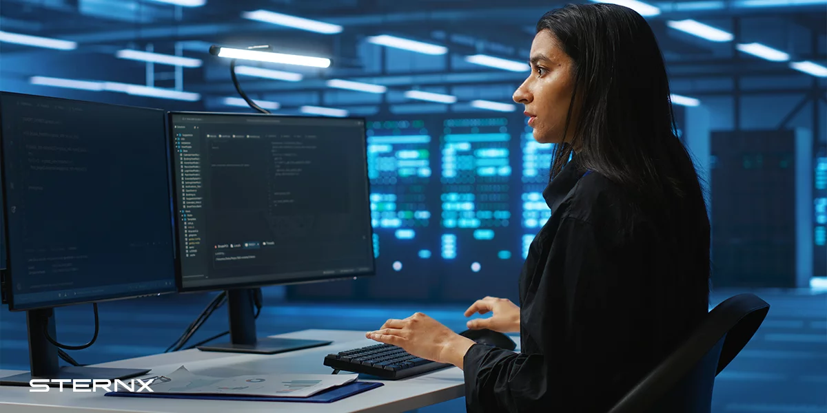 Advancements in Cybersecurity Technologies. A woman working in cybersecurity analyzing data.